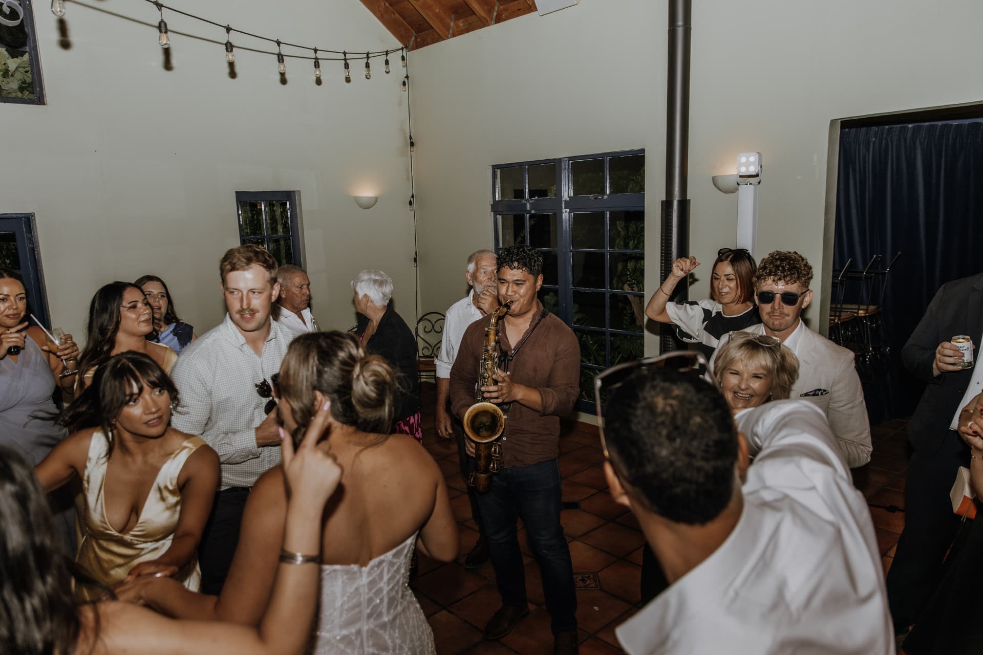 Live saxophone performance with guests dancing at a Christchurch wedding